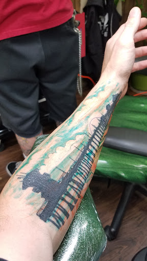 Explore angel memorial tattoo ideas, creative tattoo ideas in Orange, available at Leftys Tattoo