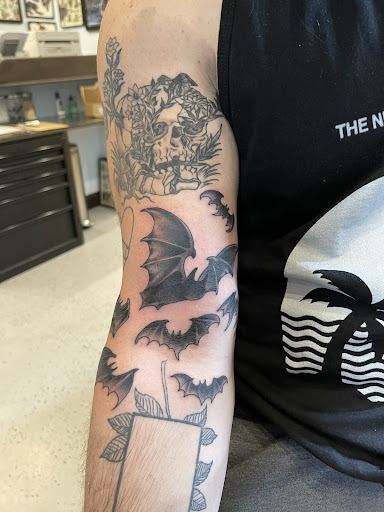 Explore boxing gloves tattoo ideas, creative tattoo ideas in Providence, available at The Torchbearer Tattoo