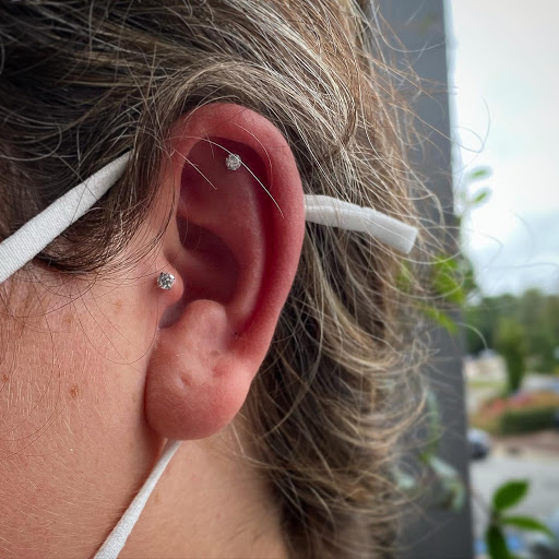 Explore watercolor flower tattoo ideas, creative tattoo ideas in Cary, available at Fine Art Body Piercing By Lilith Mae