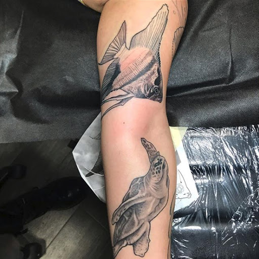 Explore fish tattoo ideas, creative tattoo ideas in Baldwin, available at Salvation Tattoo