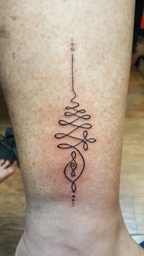 Explore boyfriend and girlfriend tattoo ideas, creative tattoo ideas in Merrick, available at Wyld Chyld Tattoo