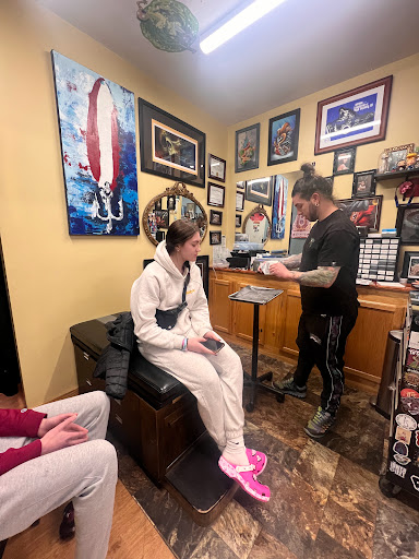 Explore tattoo ideas for new dads, creative tattoo ideas in Rochester, available at Sacred Heart Studios