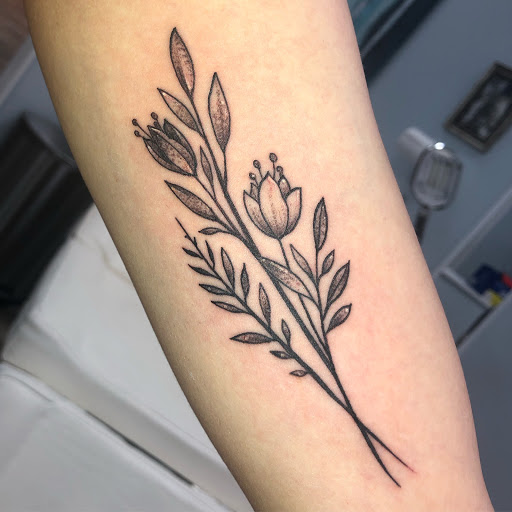 Explore small ear tattoo ideas, creative tattoo ideas in Buford, available at Wild Tribe Tattoos and Piercings