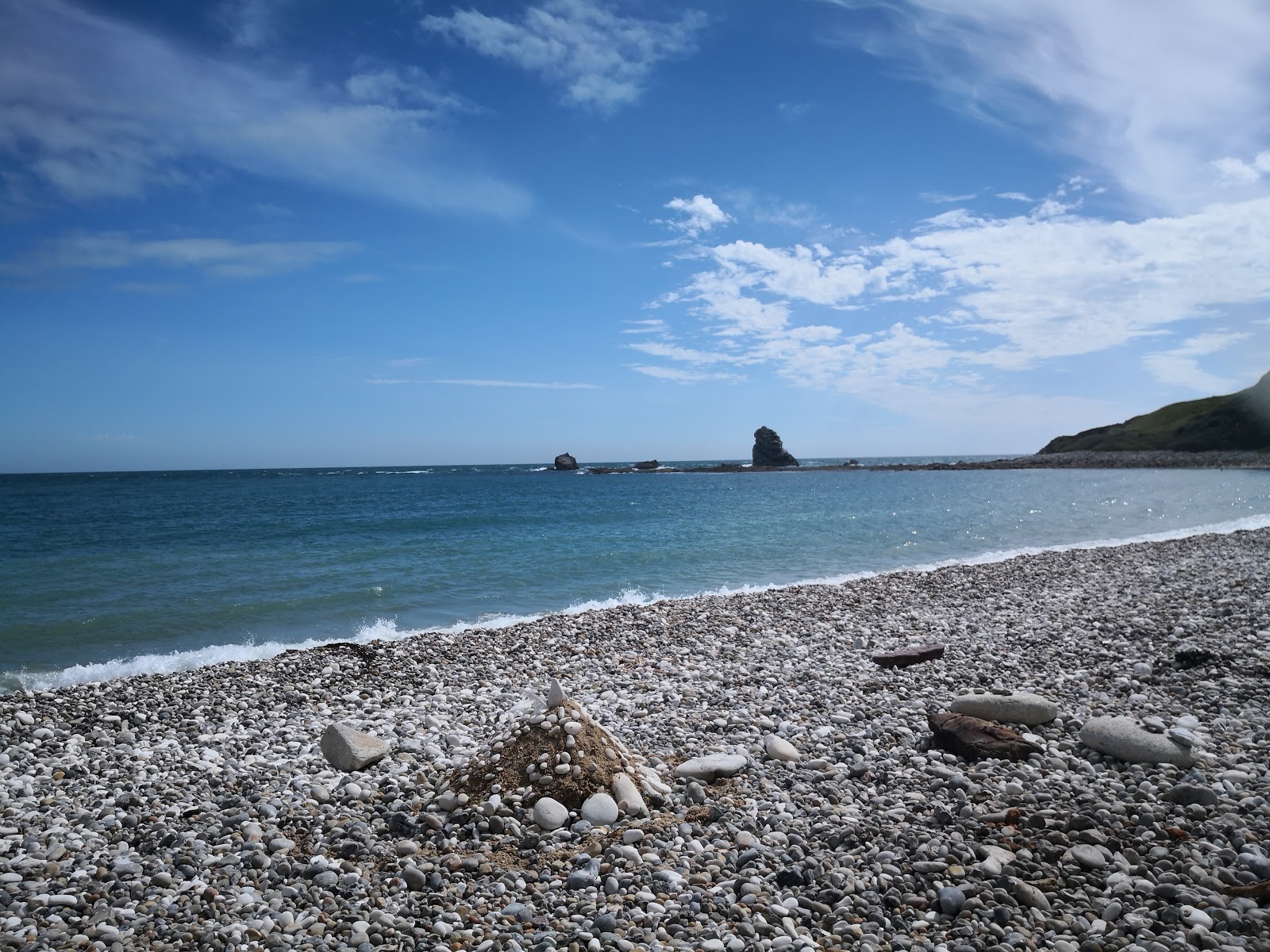 Fotografija Mupe Bay beach z prostoren zaliv