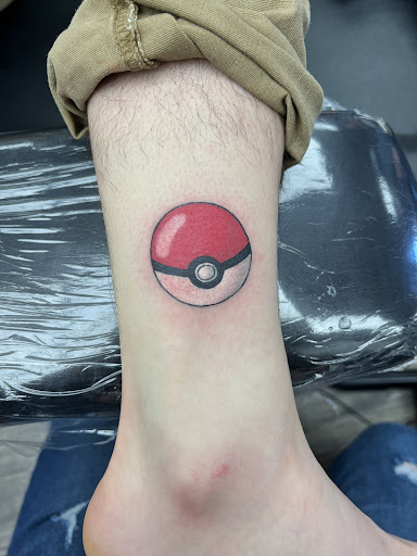 Explore mens rose tattoo ideas, creative tattoo ideas in Alfred, available at Tattooed Spirit