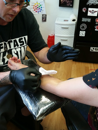 Explore christmas tree tattoo ideas, creative tattoo ideas in Port Angeles, available at Slung Down Body Art