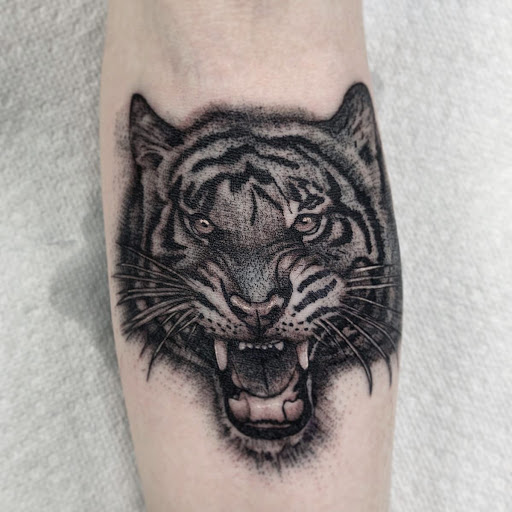 Explore hand and finger tattoo ideas, creative tattoo ideas in Matthews, available at Divine Arts Tattoo Company