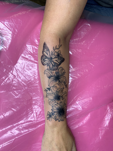 Explore moonshine tattoo ideas, creative tattoo ideas in Lake City, available at Crooked Spines Tattoo Studio