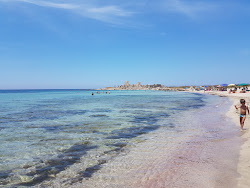 Spiaggia Tipa'in fotoğrafı geniş bir kıyı şeridi ile birlikte