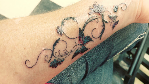 Explore minimalist dog tattoo ideas, creative tattoo ideas in Graham, available at Tattoo Haus