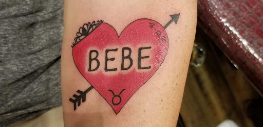 Explore cover up tattoo ideas female back, creative tattoo ideas in Oceanside, available at The Arcade Oceanside Tattoo