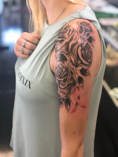 Explore honeysuckle tattoo ideas, creative tattoo ideas in Barberton, available at Magic City Tattoo Company