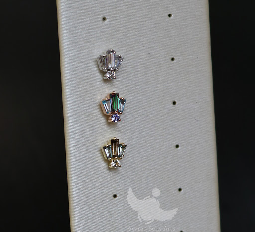 Explore long thin tattoo ideas, creative tattoo ideas in Syracuse, available at Scarab Body Arts