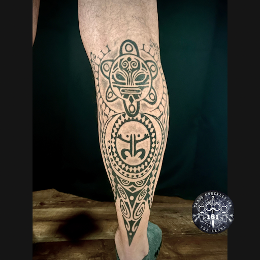 Explore front thigh tattoo ideas, creative tattoo ideas in Bronx, available at Brass Knuckles Ink Tattoo Studio