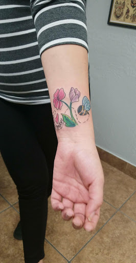 Explore dragonfly flower tattoo ideas, creative tattoo ideas in Glendale, available at Light Heart Tattoo