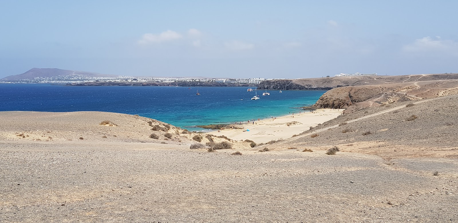 Foto van Playa del Pozo met turquoise puur water oppervlakte