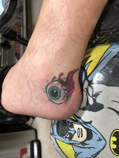 Find rib tattoo ideas for females for your next unique tattoo in Terre Haute at Under the Gun Inc