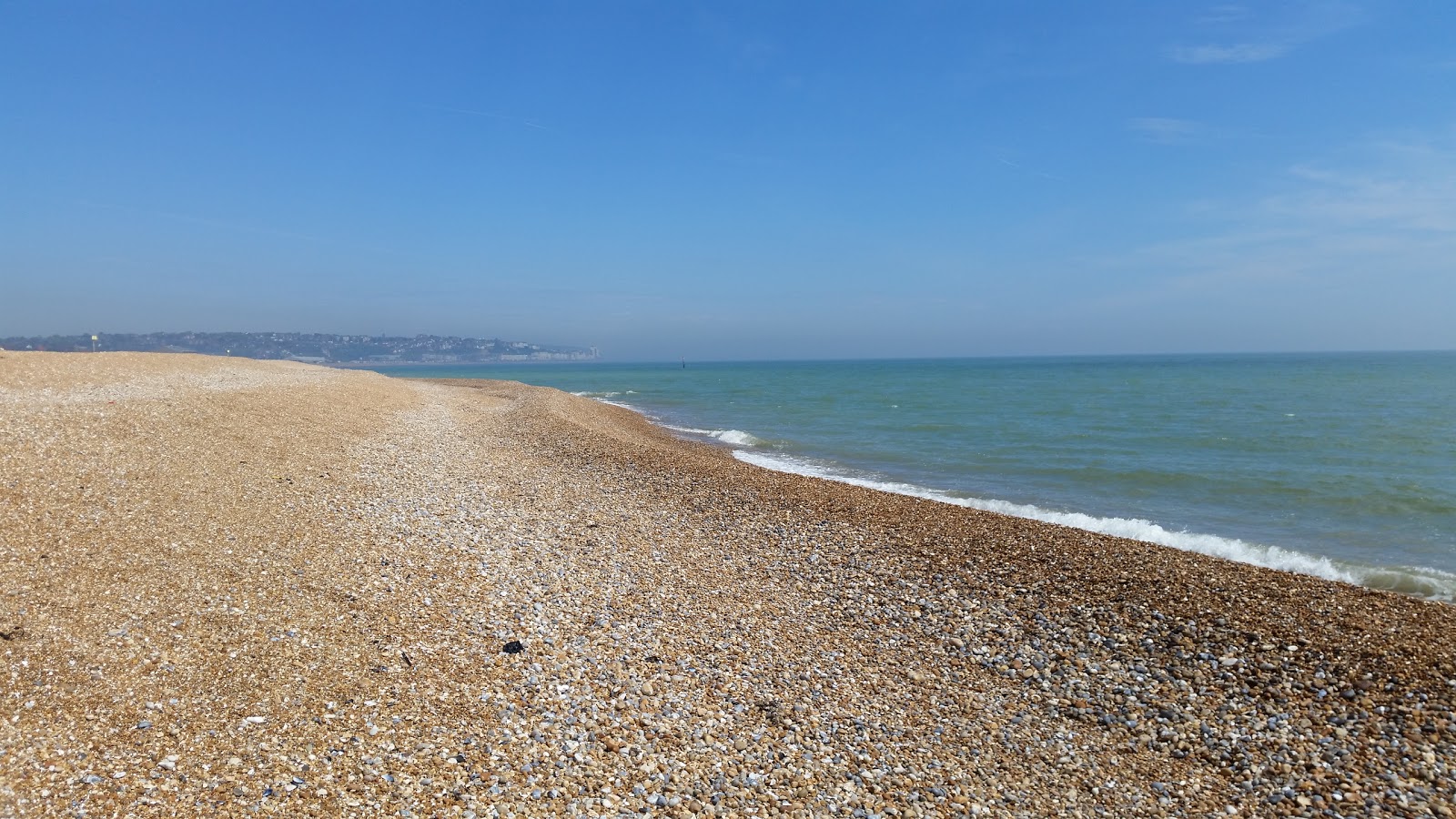 Photo of Bexhill beach with blue water surface