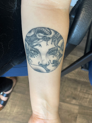 Explore floral arm sleeve tattoo ideas, creative tattoo ideas in Ottumwa, available at Family Tradition TattoosPiercings