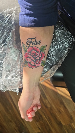 Explore collage tattoo ideas, creative tattoo ideas in Clive, available at Wild Rose Tattoo & Piercing