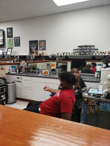 Explore arm tattoo cover up ideas, creative tattoo ideas in Hampton, available at Blue Horseshoe Tattoo and Body Piercing