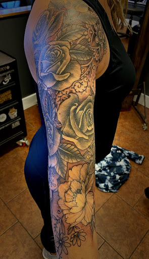 Explore blue rose tattoo ideas, creative tattoo ideas in Osage Beach, available at Rabbits Foot Tattoo Parlor