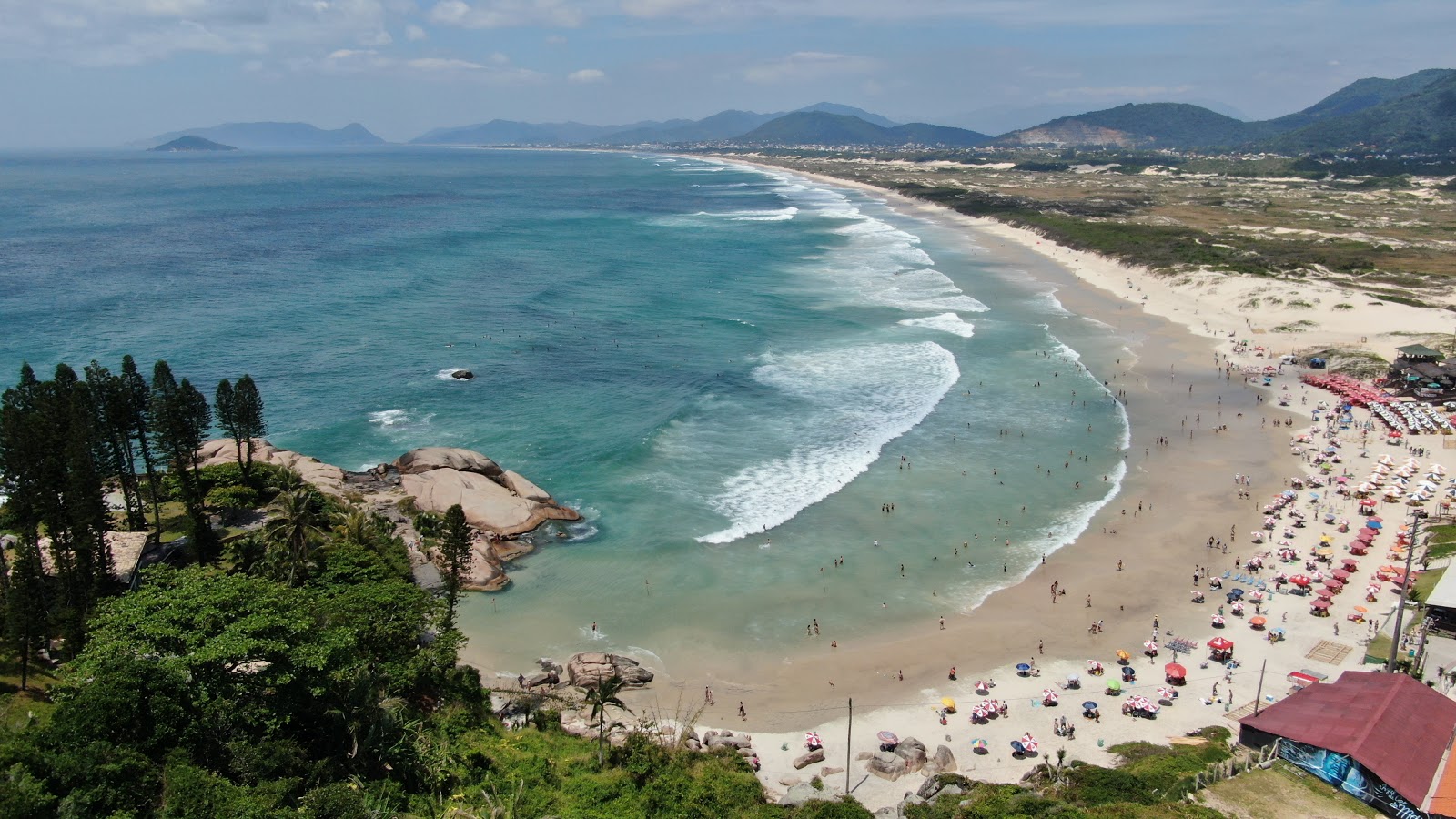 Photo of Joaquina Beach with turquoise pure water surface