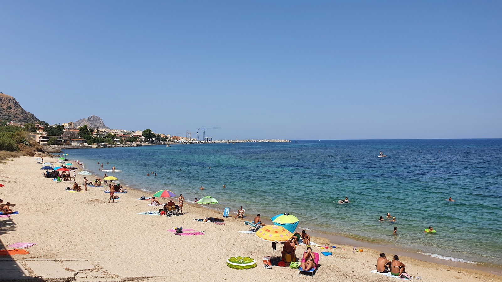 Foto av Aciddara beach med små beige småsten yta