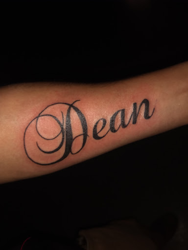 Explore lily flower tattoo ideas, creative tattoo ideas in Greeneville, available at Outhouse Tattoo