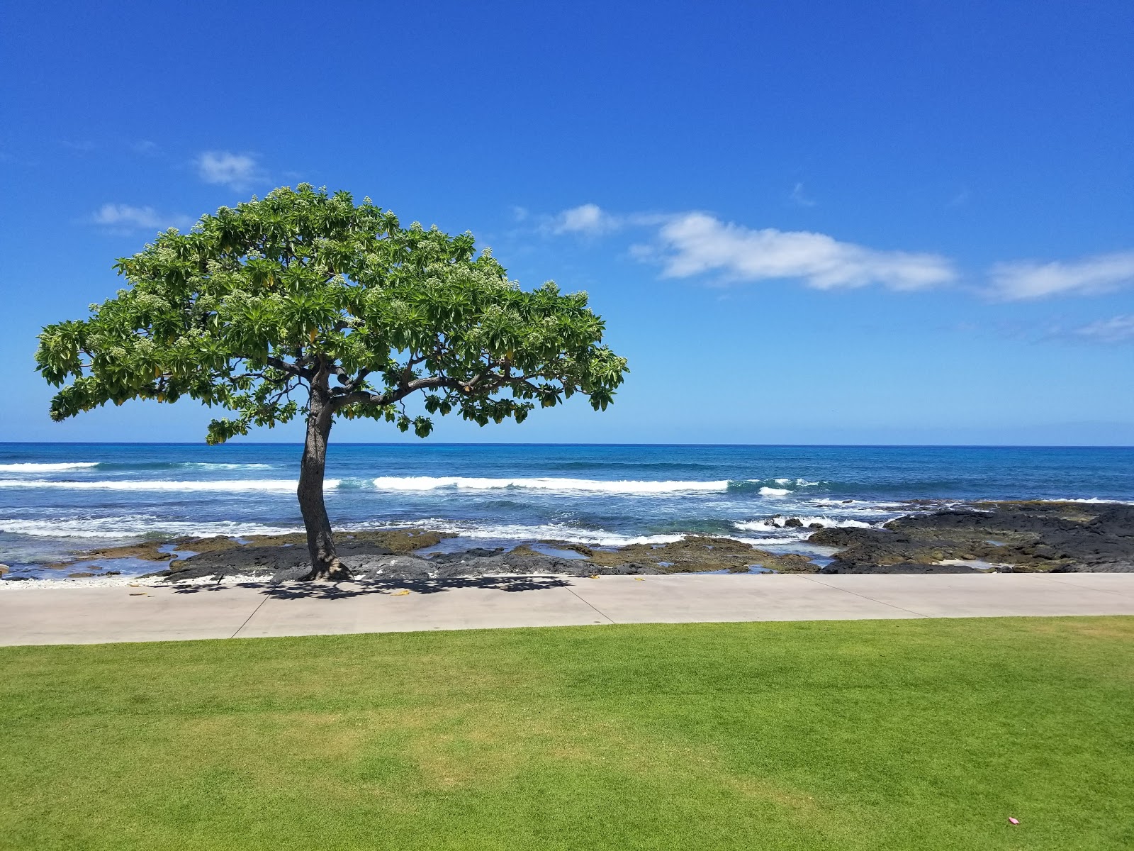 Foto van Kumukea Beach met een ruime kustlijn