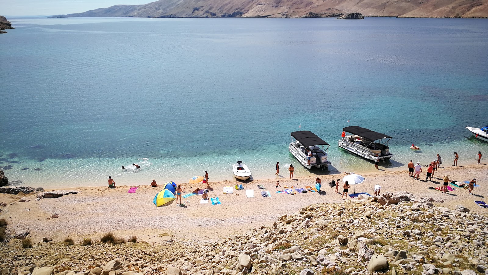 Foto av Malin beach med lätt fin sten yta