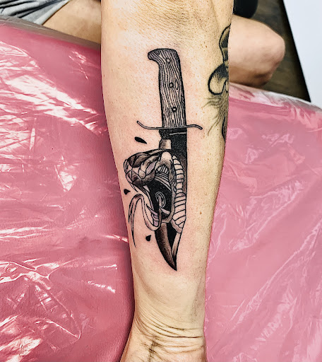 Explore female neck tattoo ideas, creative tattoo ideas in Lake City, available at Crooked Spines Tattoo Studio