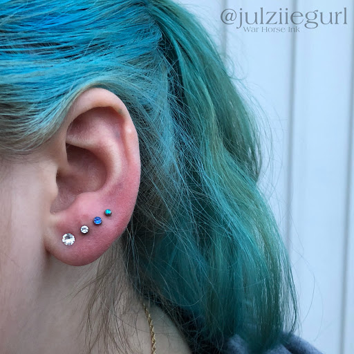 Explore arm tribal tattoo cover up ideas, creative tattoo ideas in Kent, available at War Horse Ink