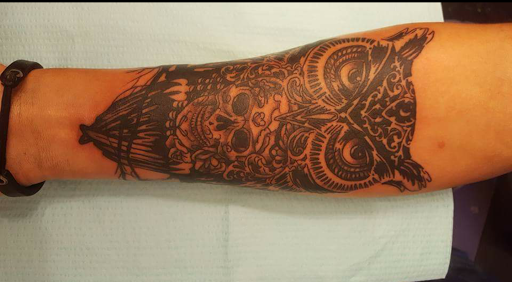 Explore gym tattoo ideas, creative tattoo ideas in Tulsa, available at Lucky Lizzard Tattoo, LLC.