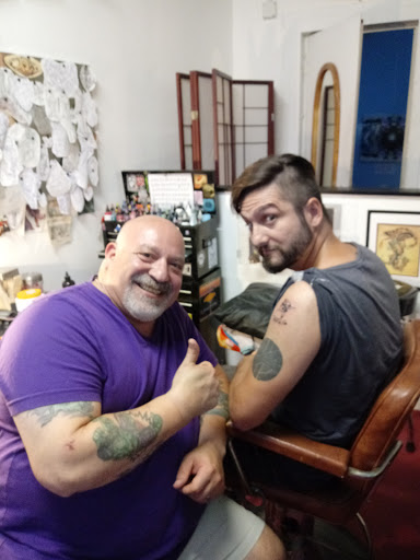 Explore tattoo ideas for a name cover up, creative tattoo ideas in New Orleans, available at Catahoula Tattoo 