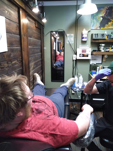 Explore feminine tattoo sleeve ideas, creative tattoo ideas in East Lansing, available at Ink & Needle East