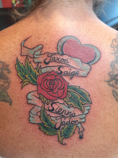 Explore small rose tattoo ideas, creative tattoo ideas in Rockford, available at Reigning Ink Tattoo Emporium