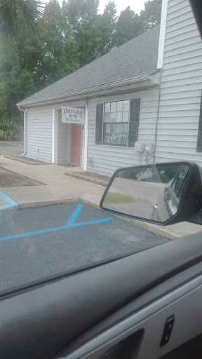 Find back tattoo ideas women for your next unique tattoo in North Charleston at Piercing Perfection