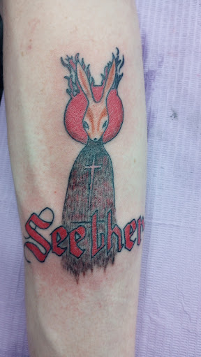 Find dog tattoo idea for your next unique tattoo in Moline at Lucky Anchor Tattoo & Piercing LLC