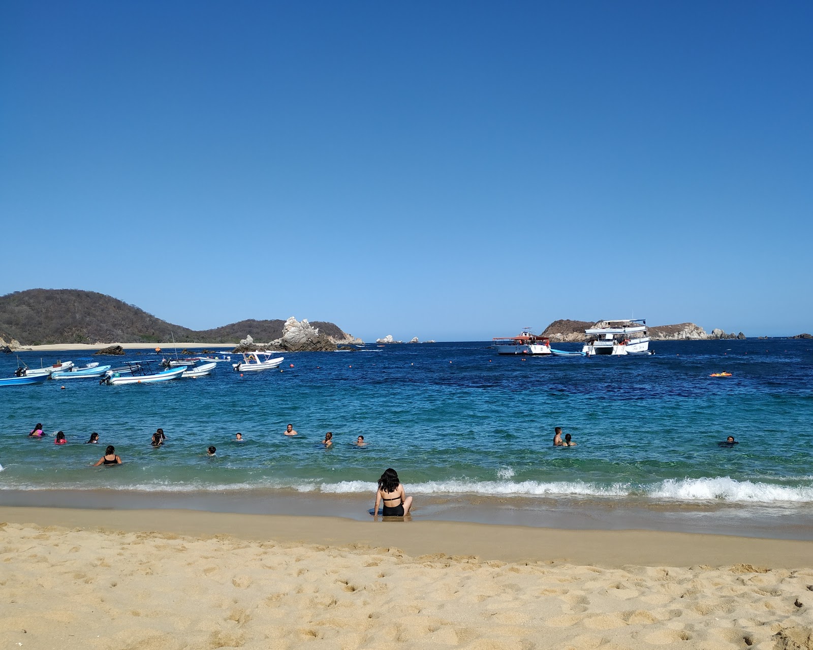Photo de San Agustin beach avec l'eau cristalline de surface