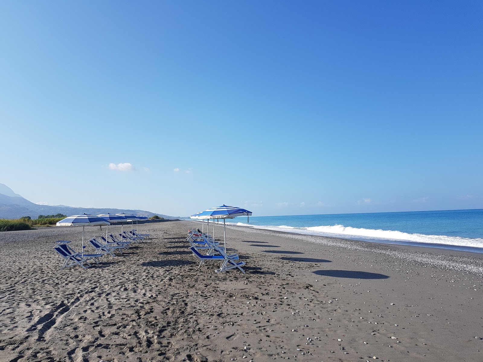 Foto van Spiaggia di Scalea II met recht en lang