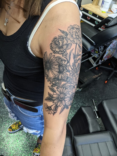 Explore afro tattoo ideas, creative tattoo ideas in Slippery Rock, available at Dinky Dachshund Tattoo Parlor
