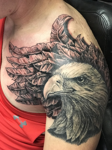 Find breast tattoo ideas for females for your next unique tattoo in Cicero at Skin Funk Tattoo