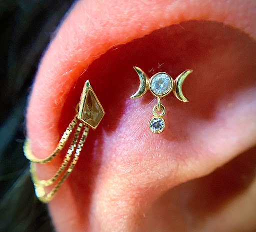 Explore leg sleeve tattoo ideas for men, creative tattoo ideas in Orange, available at Symbiosis Body Piercing