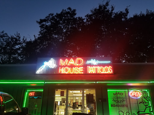 Find between the breast tattoo ideas for your next unique tattoo in Denison at Mad House Tattoos