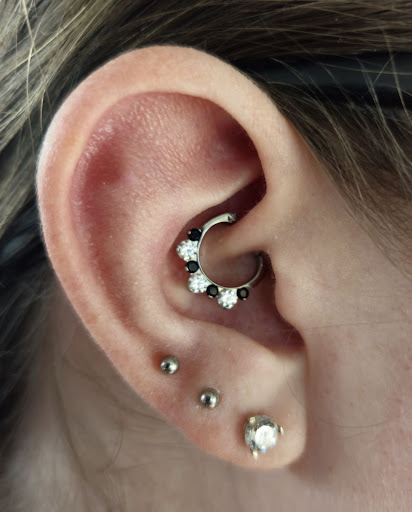 Explore tombstone movie tattoo ideas, creative tattoo ideas in Clive, available at Prysm Jewelry & Piercing