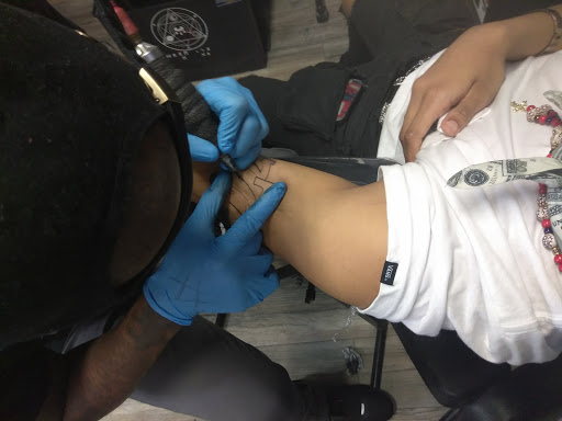 Explore lower sleeve tattoo ideas, creative tattoo ideas in Atlanta, available at Iron Palm Tattoos & Body Piercing Atlanta