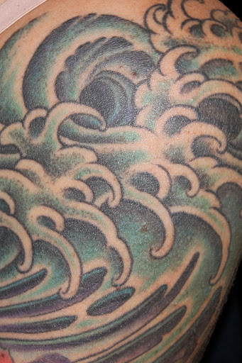 Explore cat and dog tattoo ideas, creative tattoo ideas in Boulder, available at Rising Tide Tattoo Emporium