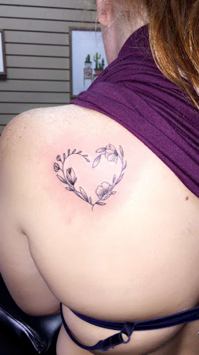 Explore mens rib tattoo ideas, creative tattoo ideas in Foley, available at Symbolic Ink Tattoo Studio