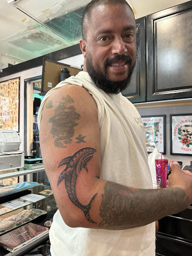 Explore handcuff tattoo ideas, creative tattoo ideas in Honolulu, available at Aloha Tattoo Waikiki Hilton Hawaiian Village Rainbow Bazaar